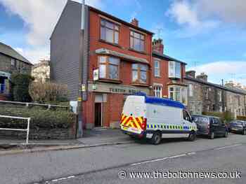 Police search continues at former builder's merchants near Bolton