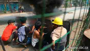 Myanmar military imposes martial law over country's largest city after dozens killed