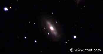 Astronomers puzzled by a supermassive black hole moving strangely in deep space     - CNET