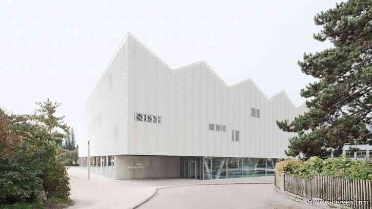Wulf Architekten creates school sports centre with zigzag roof informed by the Alps
