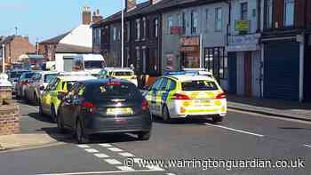 No arrests after police raid shops and flats on Orford Lane