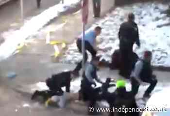 Video appears to show officer kneeling on neck in violent clash clearing Minneapolis homeless encampment