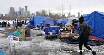 City's attempt to clear Minneapolis homeless camp leads to scuffles between police, camp defenders