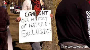 Dozens gather in Elmwood Village to march against racism against Asian people