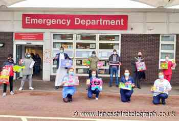 Blackburn firm donates toys and goodies to children in hospital