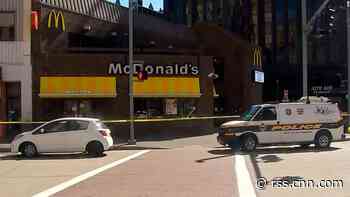 A 12-year-old and his family were waiting in line at McDonald's when a man stabbed the boy in the neck, police say
