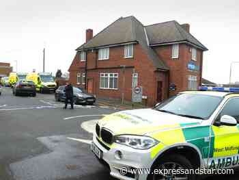 Police help man down from factory roof in Dudley as road closed - expressandstar.com
