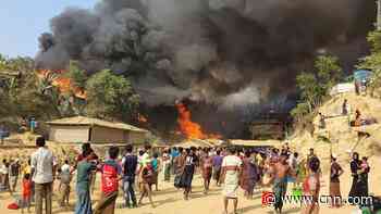 Refugees flee on foot as massive fire destroys homes of thousands