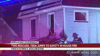 Two recused, teen jumps from roof of house fire on Finch Street