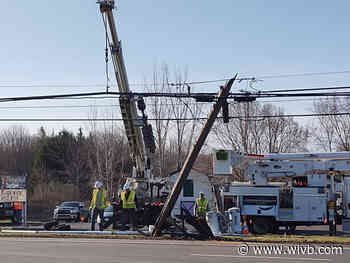 Driver crashes into pole, temporarily closing part of Broadway