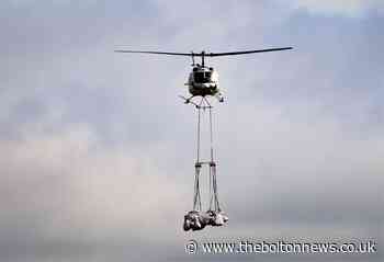 Helicopter helping to restore Bolton moorlands after Winter Hill wildfires - The Bolton News