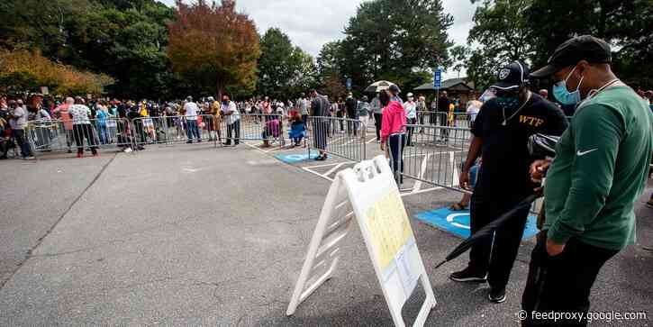 Georgia governor signs sweeping election reform bill that will expand early voting and make IDs required for absentee ballots