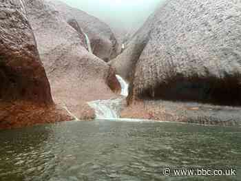 Uluru waterfalls: Rain brings 'unique' sight to Australian landmark