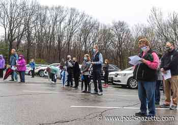 Church regathers on a rainy Palm Sunday