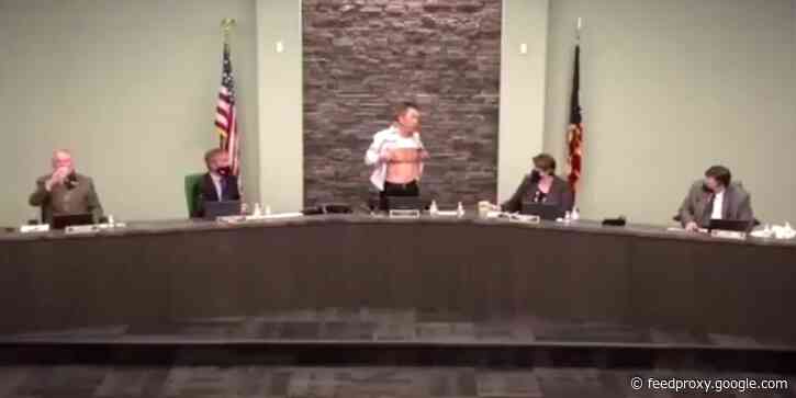 'Is this patriot enough?' Asian-American Army veteran protests racism by displaying wounds from military service during a town hall meeting