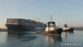 Cargo ship stuck in Suez Canal partially free but salvage firm boss says 'don't cheer too soon'