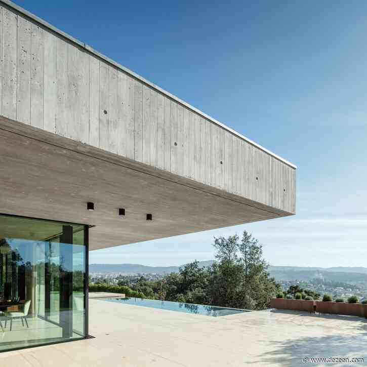 Trama Arquitetos creates raw concrete house above cork tree grove in Braga