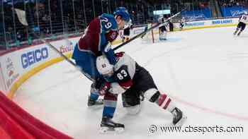 WATCH: Avalanche's Nathan MacKinnon takes helmet off of Coyotes' Conor Garland, throws it in his face