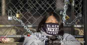 Rotation of protesters chain themselves to courthouse fence during Derek Chauvin trial in Minneapolis