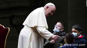 Children flock to Pope Francis during Good Friday service