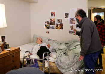 Sweet photos capture moment son reunites with 98-year-old mom after year of quarantine