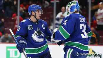 Canucks' COVID-19 troubles send chill through NHL's North Division