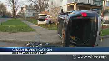 Rochester Police investigating two-car crash, car nearly hits home
