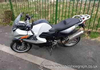 Stolen motorbike with black tape covering part of registration plate recovered by police