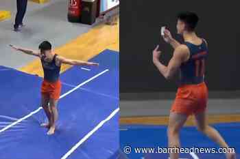 Gymnast celebrates vault success by brandishing vaccination card - Barrhead News