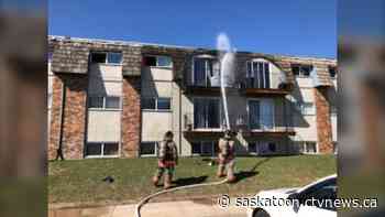 Saskatoon Fire Department respond to fire on deck and roof of apartment building