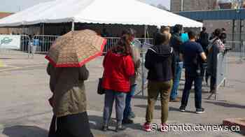 Residents brave the rain to get COVID-19 shot at Thorncliffe Park pop-up clinic