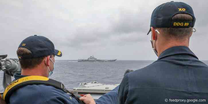 US Navy sends message to China with photo of destroyer shadowing Chinese aircraft carrier