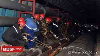 China mine rescue: Crews work to free trapped workers in Xinjiang