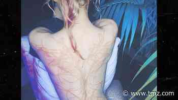 Grimes Reveals Massive Back Tattoo of 'Beautiful Alien Scars'