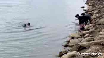 Jogger runs into river 'without thought' to save boy in Saskatoon