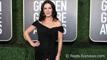 Catherine Zeta-Jones turns her closet into a runway as she struts to Madonna's 'Vogue'