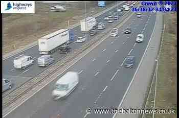 Motorists face delays after crash between lorry and car on M60