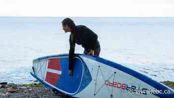 Paddle boarding to combat plastic pollution in Lake Ontario.