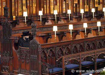 Prince Philip's funeral live updates: Queen sits alone in chapel
