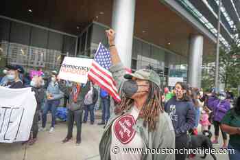 Activists protest Texas’ voter bills at Greater Houston Partnership building downtown - Houston Chronicle