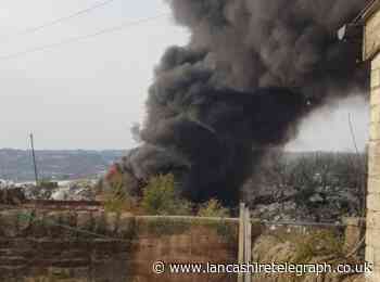 Huge fire breaks out at plastics factory in Blackburn sending plumes of thick black smoke into sky