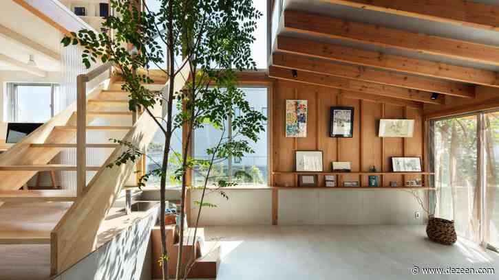 Yukawa Design Lab's Margin House is built around a multipurpose atrium with a tree