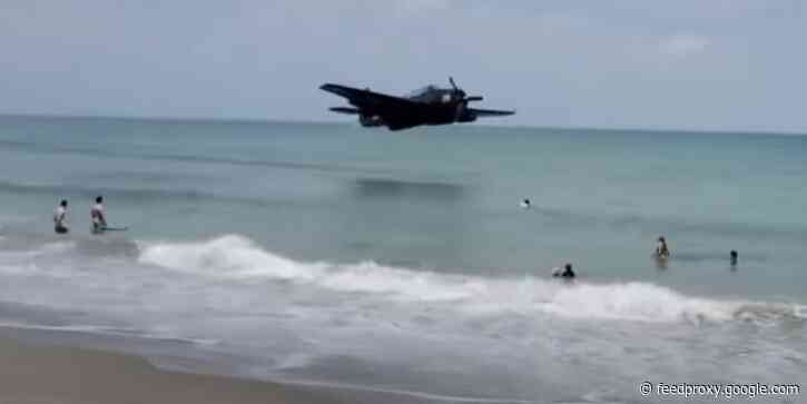Dramatic video shows World War II-era TBM Avenger making emergency landing next to people on Florida beach