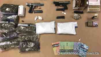 Man, 19, charged after Saskatoon police find restricted handguns, drugs, cash