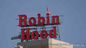 'Keep that history going': Iconic Robin Hood sign returns to Saskatoon's skyline