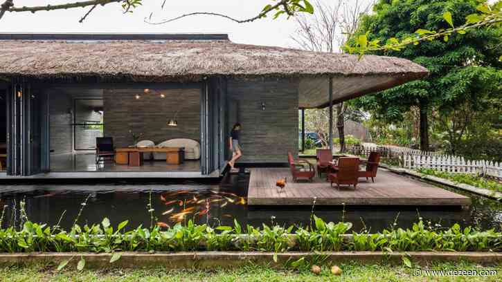 AM House is a Vietnamese holiday home surrounded by a pond and tropical gardens