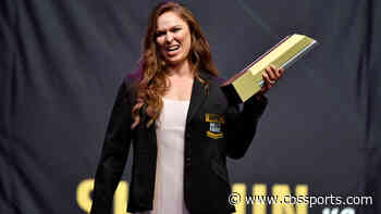 Ronda Rousey announces she is expecting her first child with husband Travis Browne