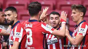 Atletico Madrid win to return to La Liga summit