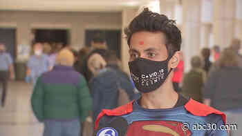 'Superman' pharmacist races to vaccinate community