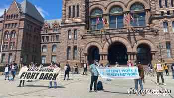 Health workers rally at Queen's Park to demand province make changes to pandemic response